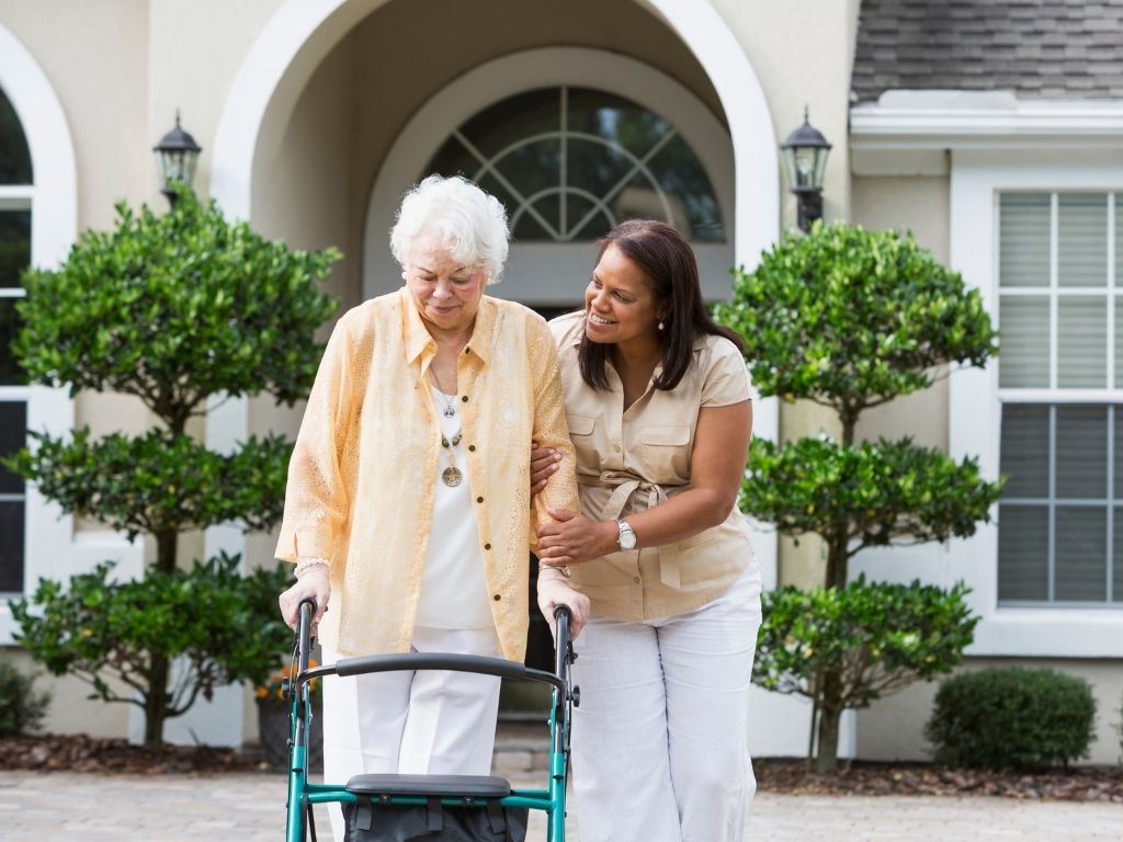 caregiver-walking-with-elderly